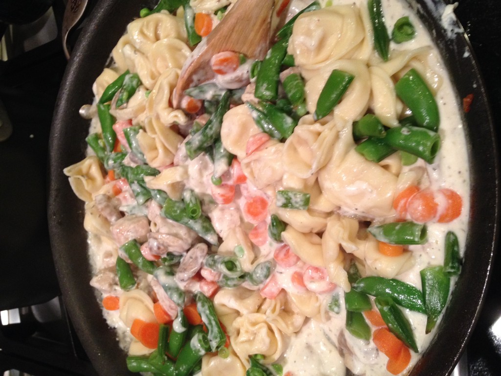 Toss to coat pasta mixture (pasta with sugar snap peas and carrots)