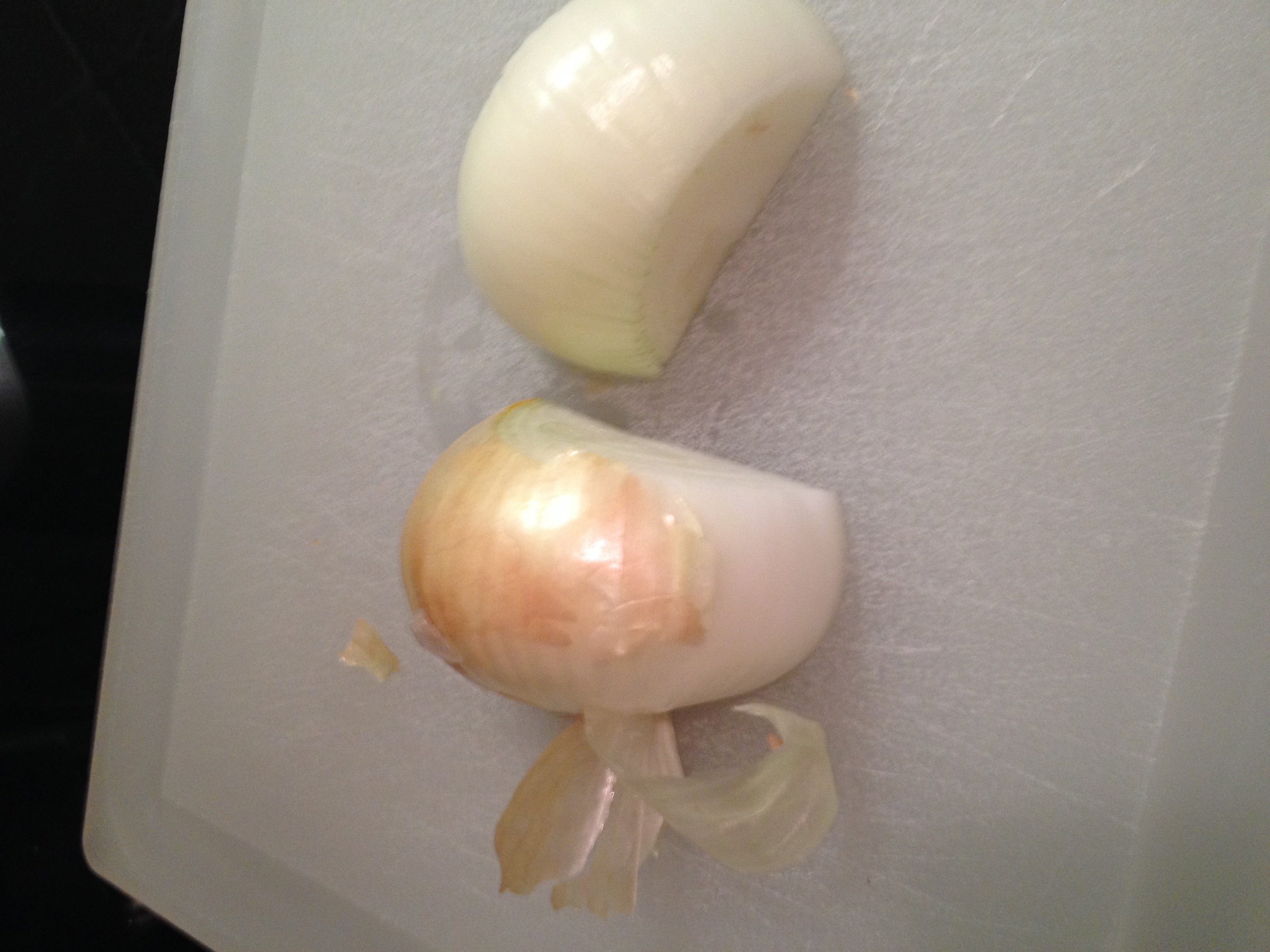 Step 3:  Cut the onion in half and peel.