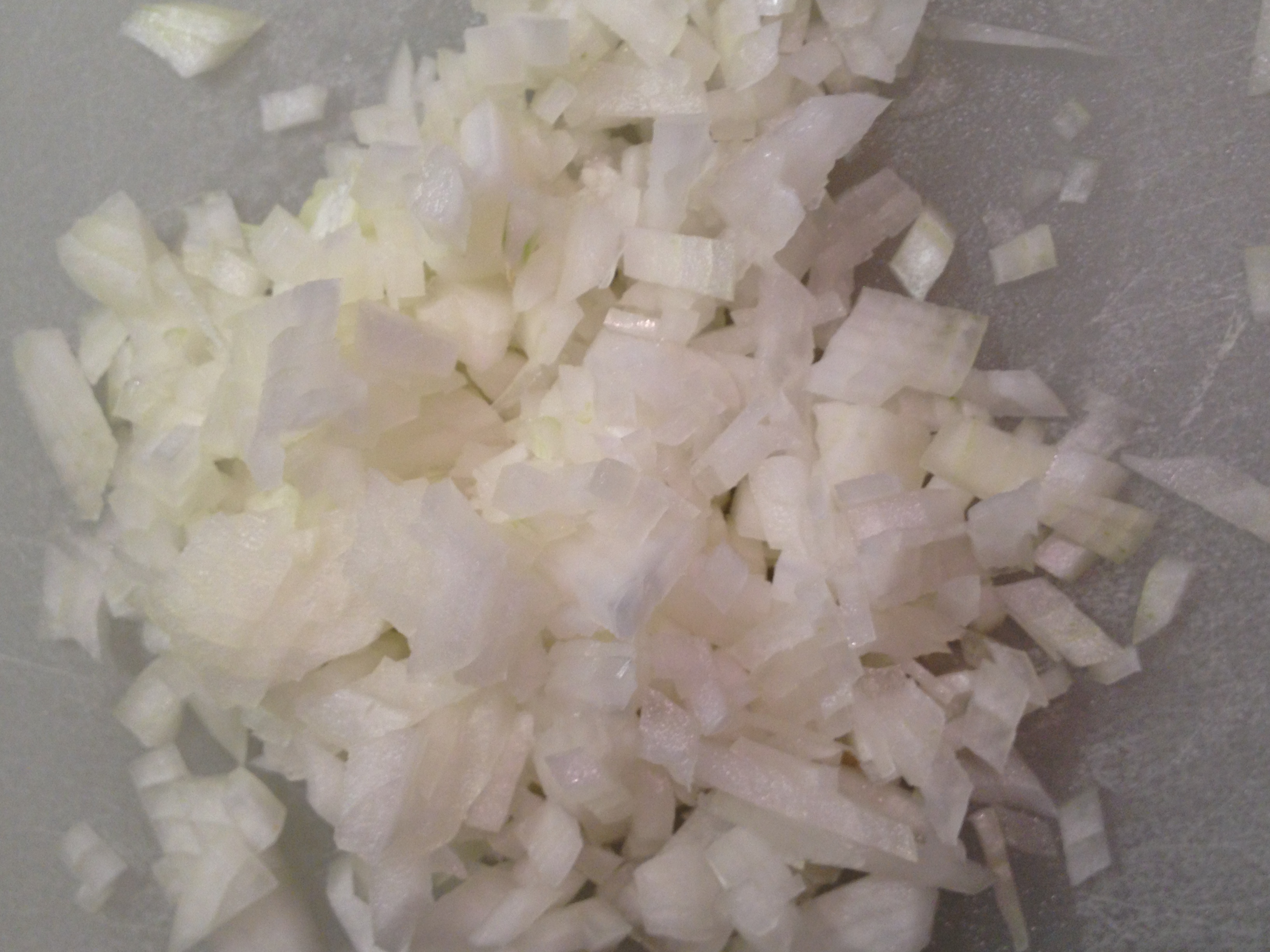 Picture of our chopped onion.   Tidbit Tip:  If a recipe calls for 1 cup of chopped onions you would chop the onion and then measure a cup.  If the recipe calls for one onion chopped you would chop the onion and use the entire onion.  The recipe will usually say what size onion to use like small, medium or large.   
