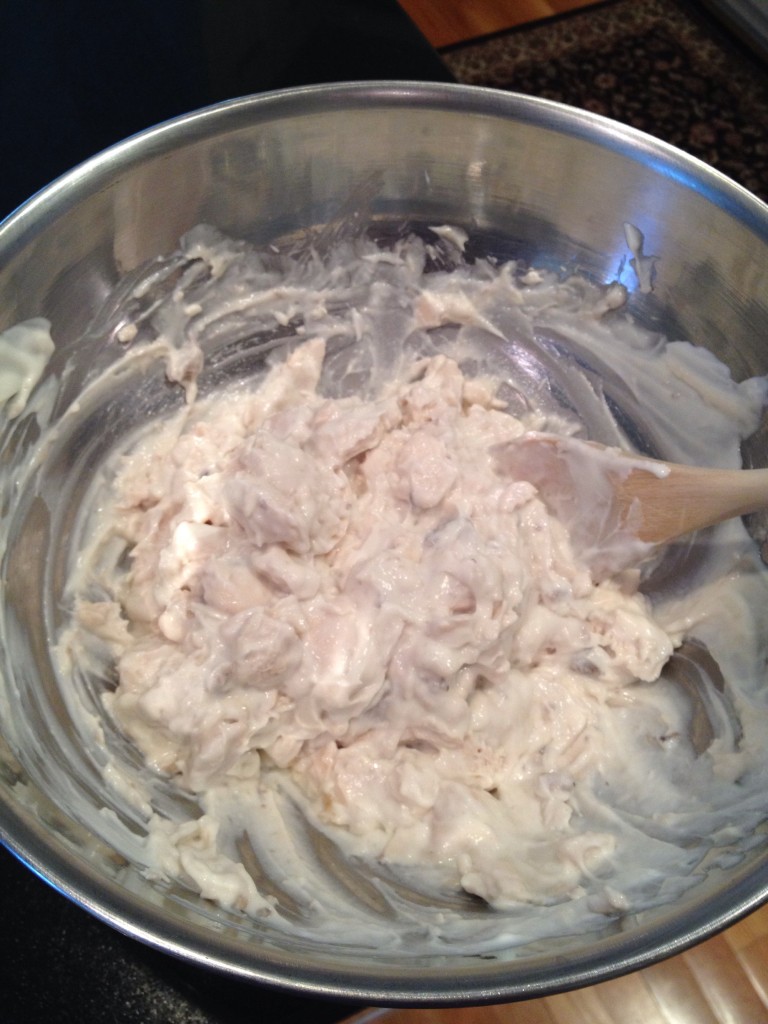 Mix chicken, mushroom soup and sour cream; stirring well
