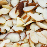 Can be blanched or natural (with a ring of brown skin still attached), are thin oval chips.
