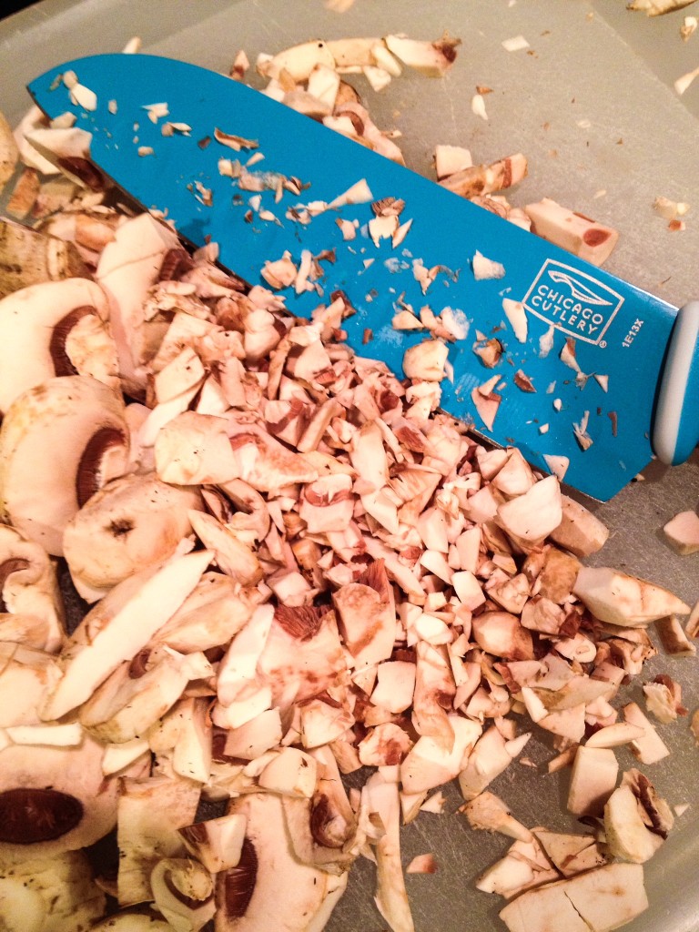 Finely chop mushrooms.  Tidbit Tip:  Use a Santoku knife to help the mushroom not to stick to the knife.  (My favorite knife)