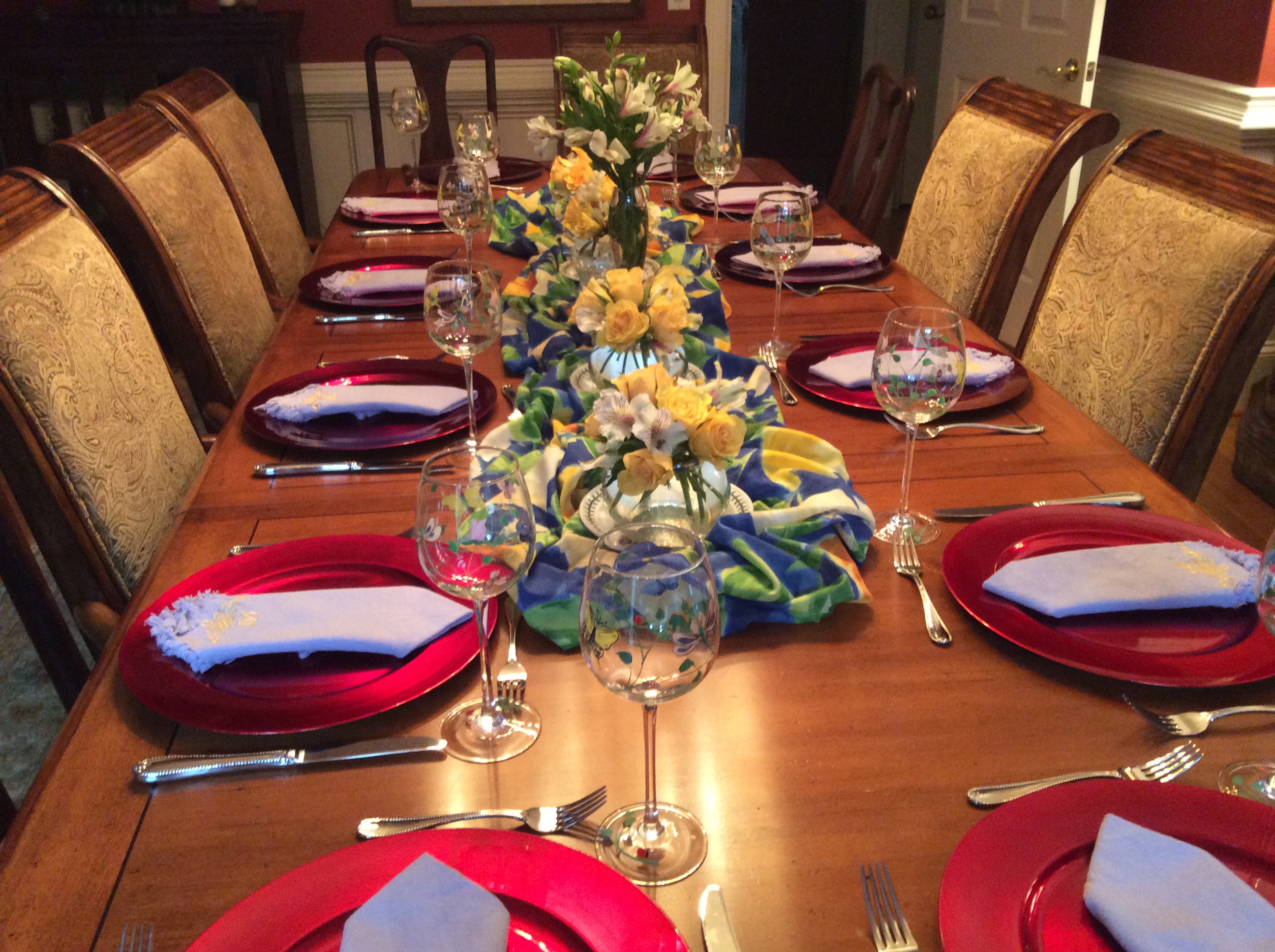 Set a pretty table with flowers and fabric down the middle.