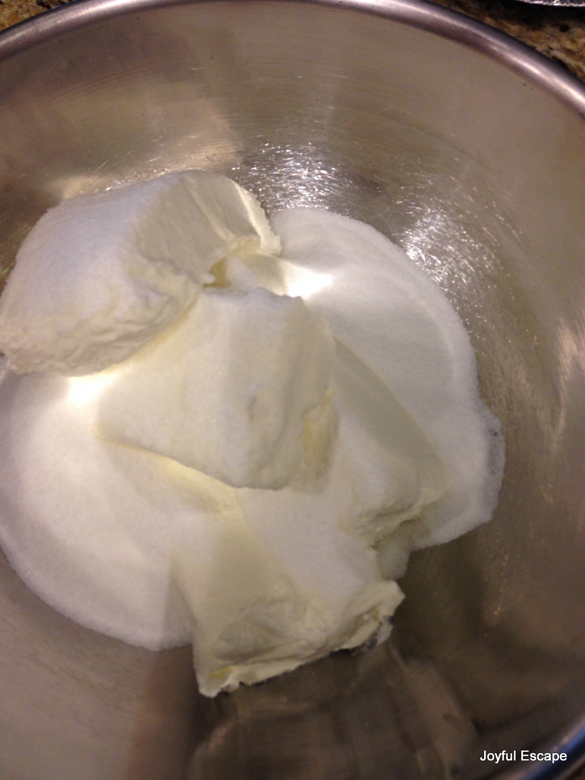 Sugar and cream cheese ready to be mixed till creamy