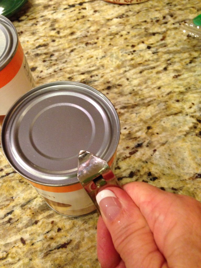 Opening cans of chicken broth